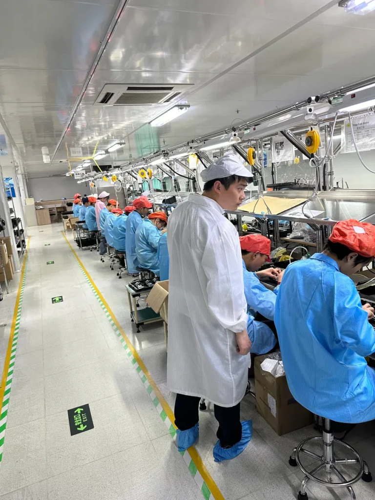 Workers on an assembly line at Inrico's production base