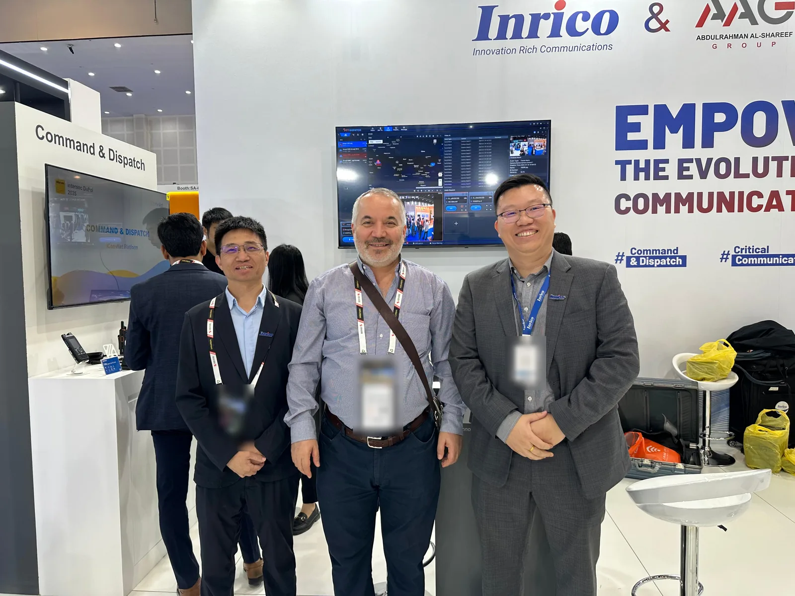 Inrico staff with a visitor at the command and dispatch display