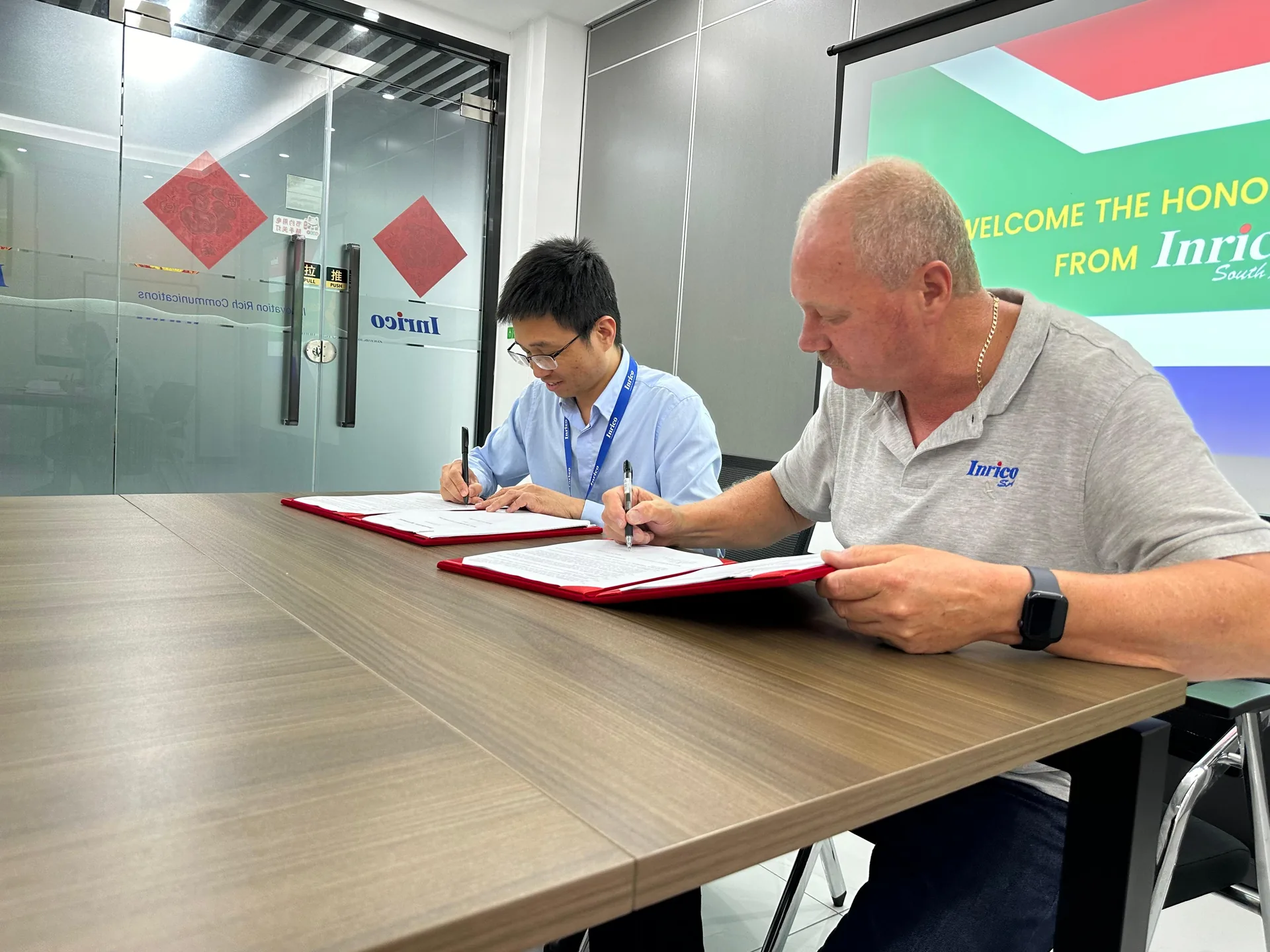 Hennie Vermaak signing the sole distribution agreement for Africa at Inrico's offices in Shenzhen
